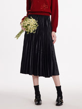 A lady wears a velour skirt.